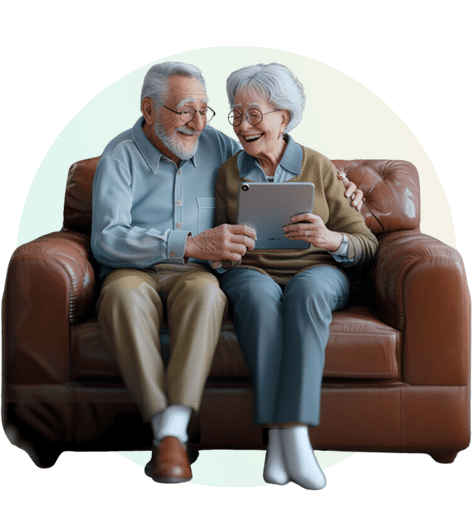 An elderly couple looking at retirement home designs on an iPad